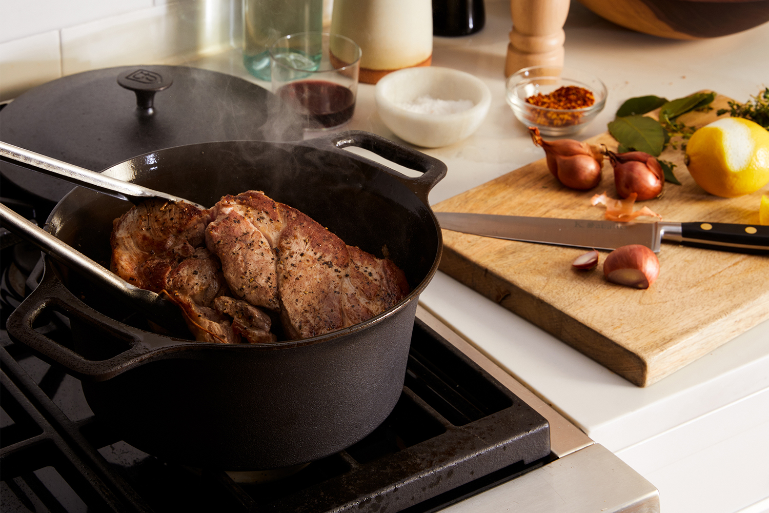 The Dutch oven from Field Company sitting on the stove. The bare cast iron pot is on sale during the brand's factory seconds sale.