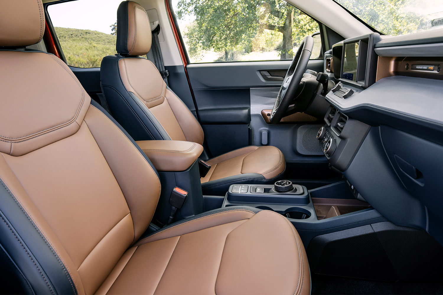 The leather seats in the 2022 Ford Maverick Lariat pickup truck. In our review, we say go for the XL hybrid.