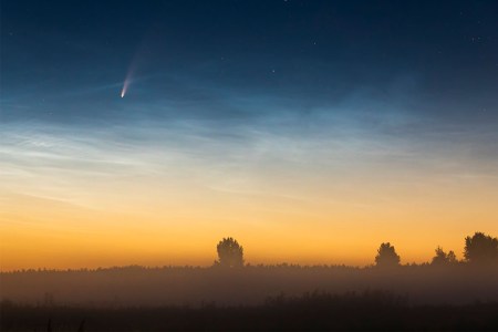A comet flying past Earth.
