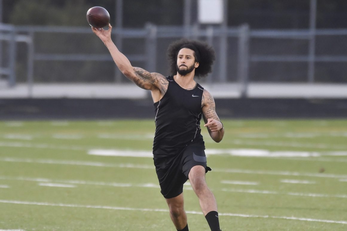 Former NFL quarterback Colin Kaepernick goes through a series of passing drills. The former 49ers quarterback says he's "still waiting" for another chance at the NFL as of March 2022.