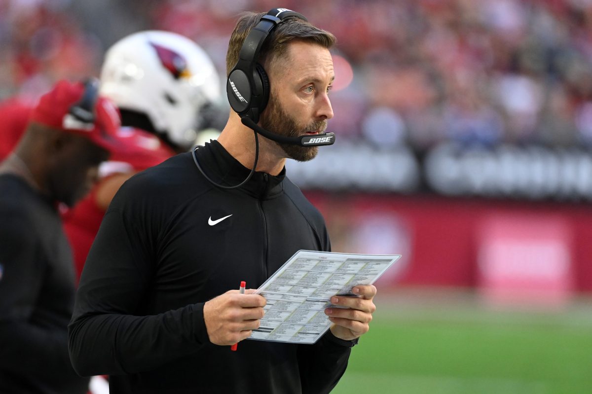 Head coach Kliff Kingsbury of the Arizona Cardinals sends in a play against the Seahawks