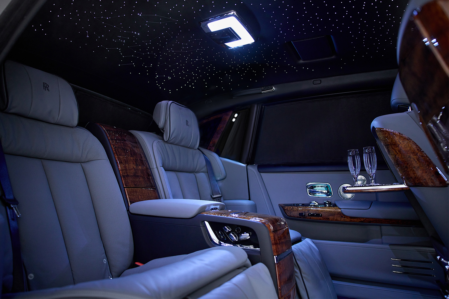 The interior of the Rolls-Royce Phantom Koa, a bespoke car that features koa wood and a Starlight Headliner featuring the night sky above Cleveland, Ohio.