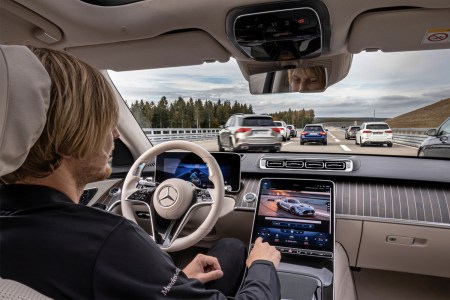 A driver using the Mercedes-Benz Drive Pilot system, driver-assistance tech that has achieved SAE Level 3 autonomy. Here's why it's better than Tesla's Autopilot and Full Self-Driving.
