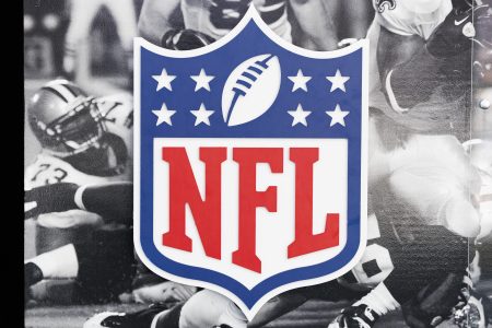 A detailed view of the NFL shield logo at the Super Bowl Experience