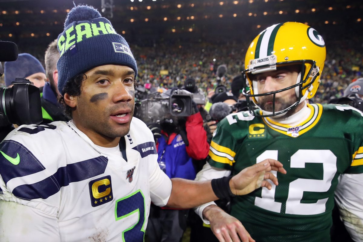 Russell Wilson greets Aaron Rodgers at Lambeau Field in 2020