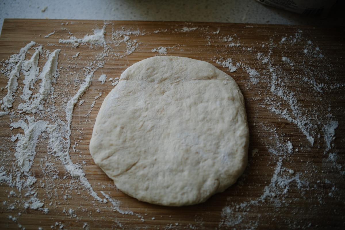 Pizza dough on a table. Scientists have figured out a way to make pizza without yeast.