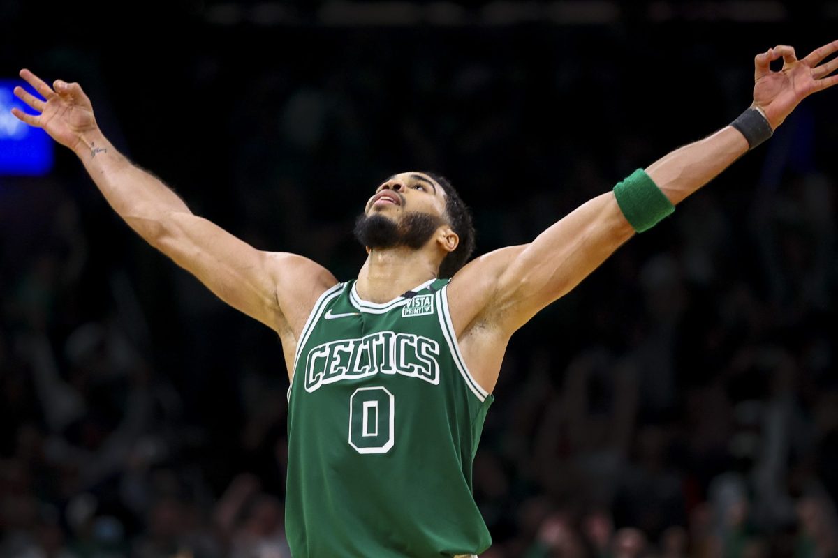 Jayson Tatum reacts after hitting a three-point shot against the Brooklyn Nets at TD Garden