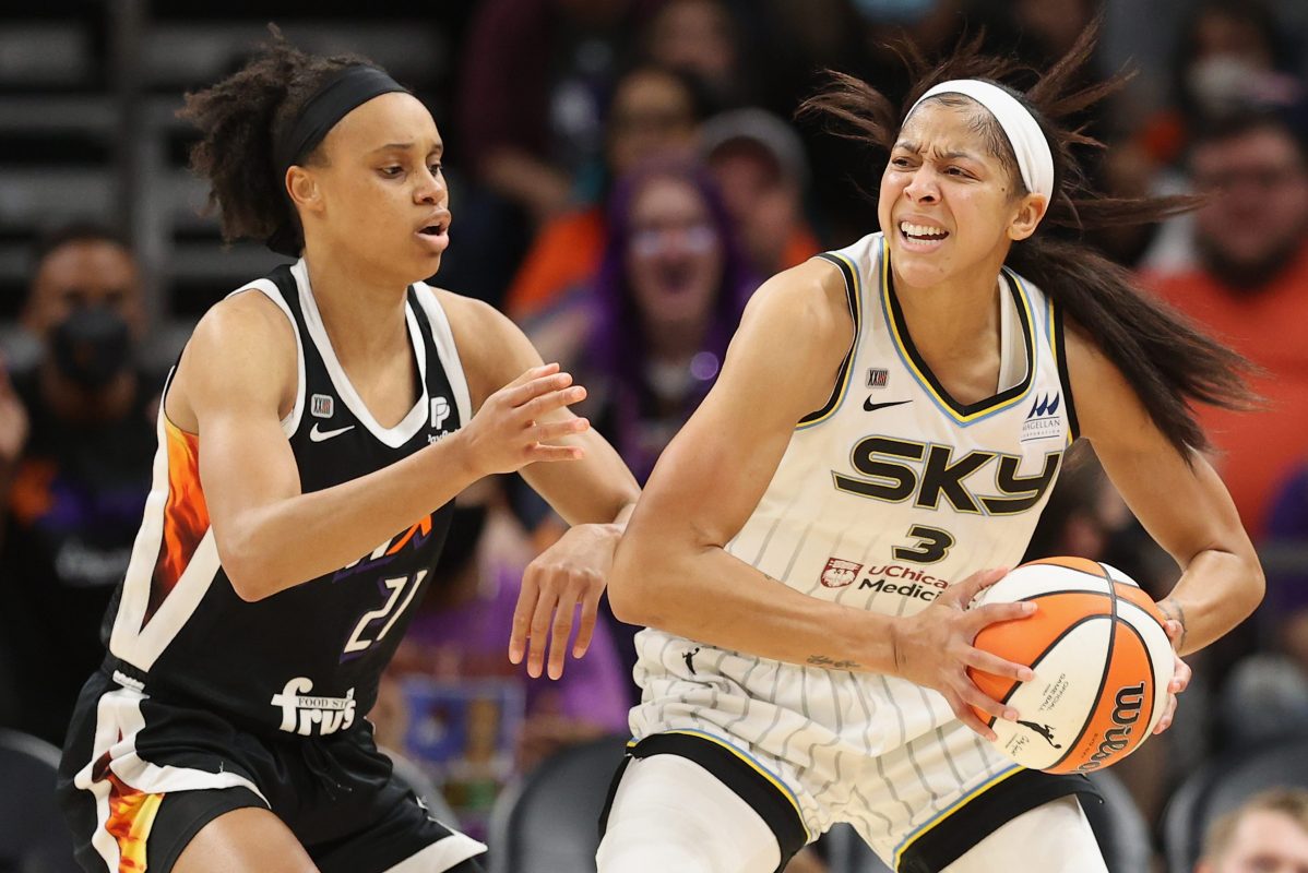 Candace Parker of the Chicago Sky looks to pass around Brianna Turner of the Phoenix Mercury during the 2021 WNBA Finals
