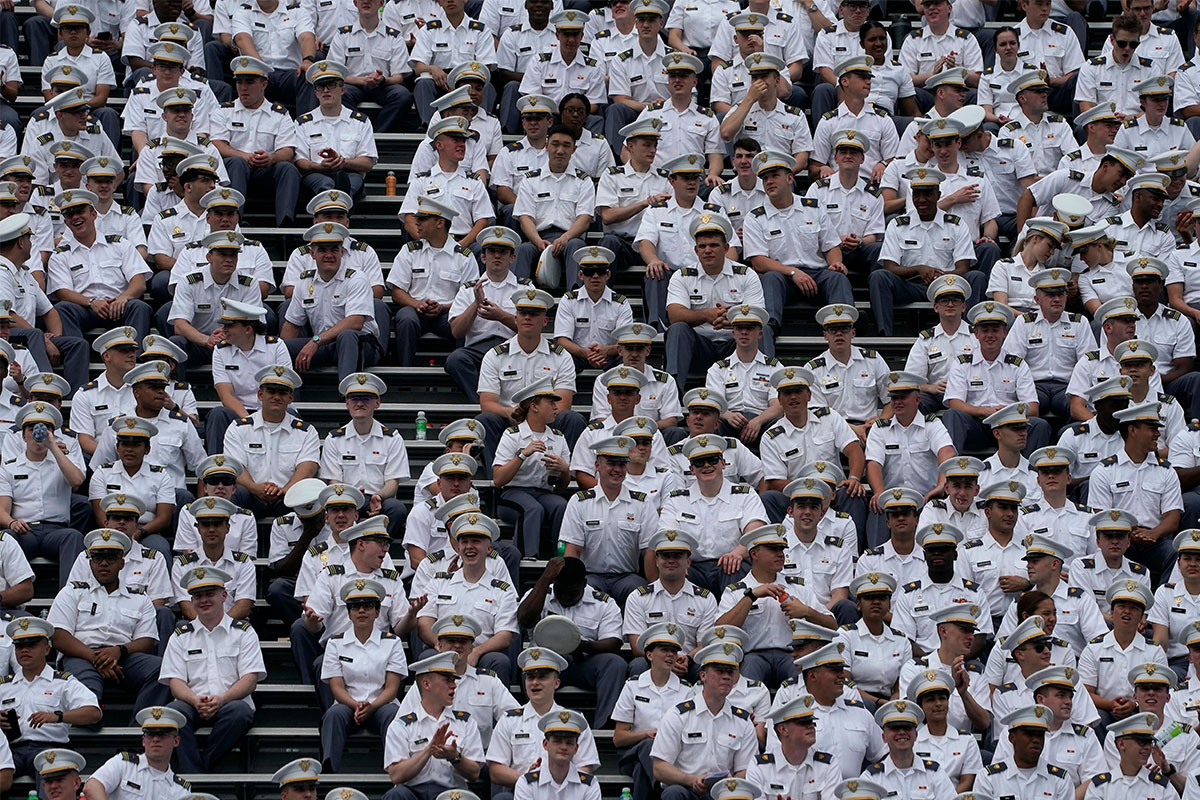 Hundreds of West Point graduates sitting on risers.
