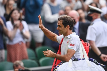 Roger Federer walks off the court at Wimbledon.