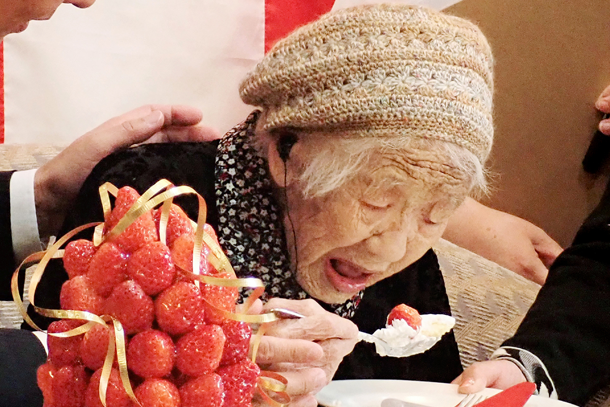 The late Kane Tanaka enjoying some birthday cake. Here are some reasons she was able to become the second oldest person on record.