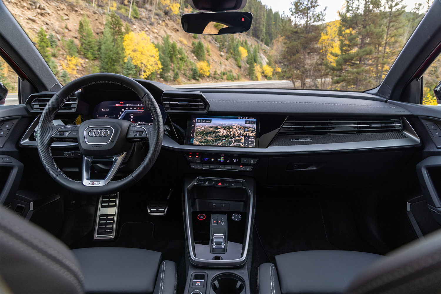 The interior of the 2022 Audi S3 performance sedan, featuring a nice mix of screens and tactile buttons and knobs