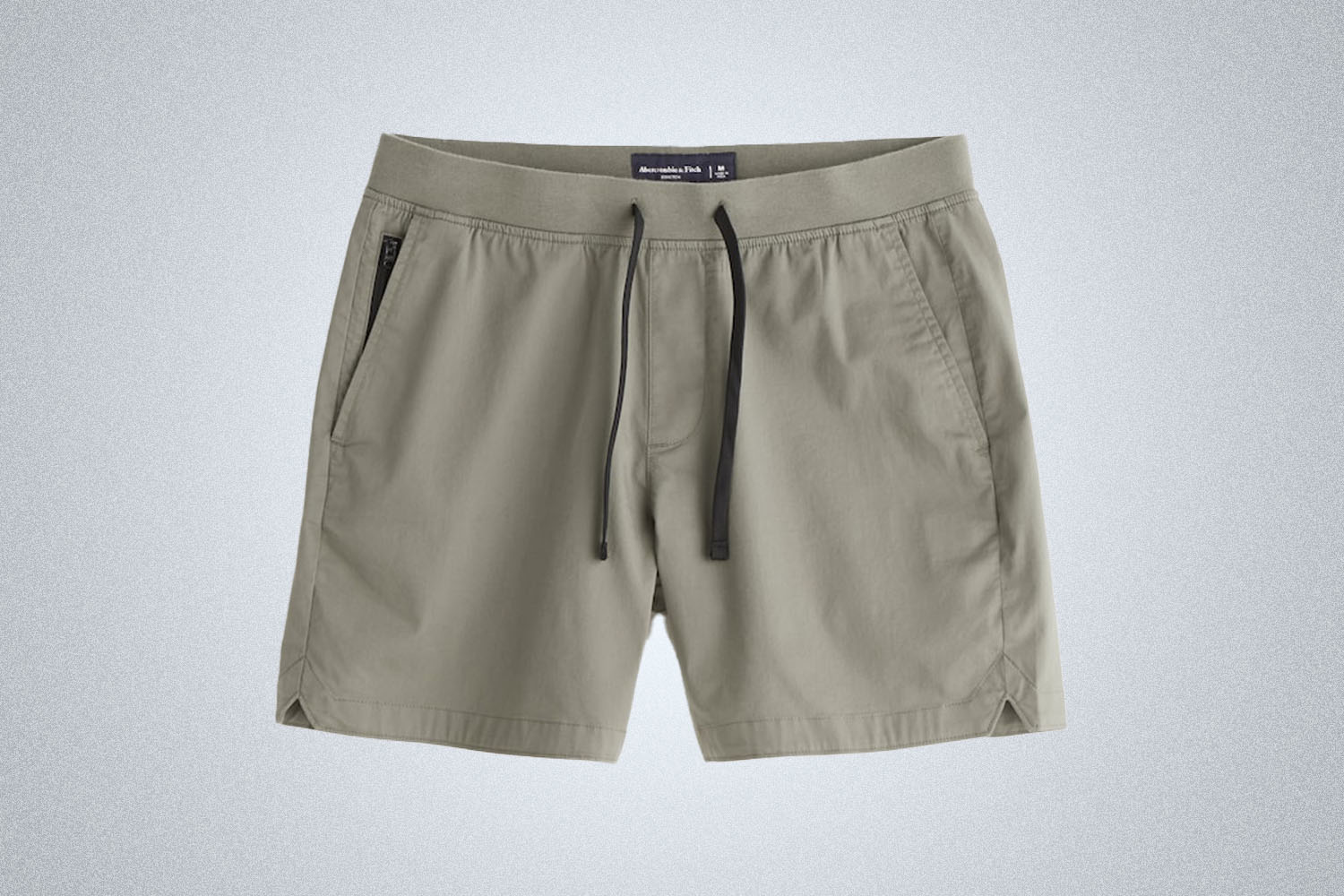 a pair of green shorts on a grey background