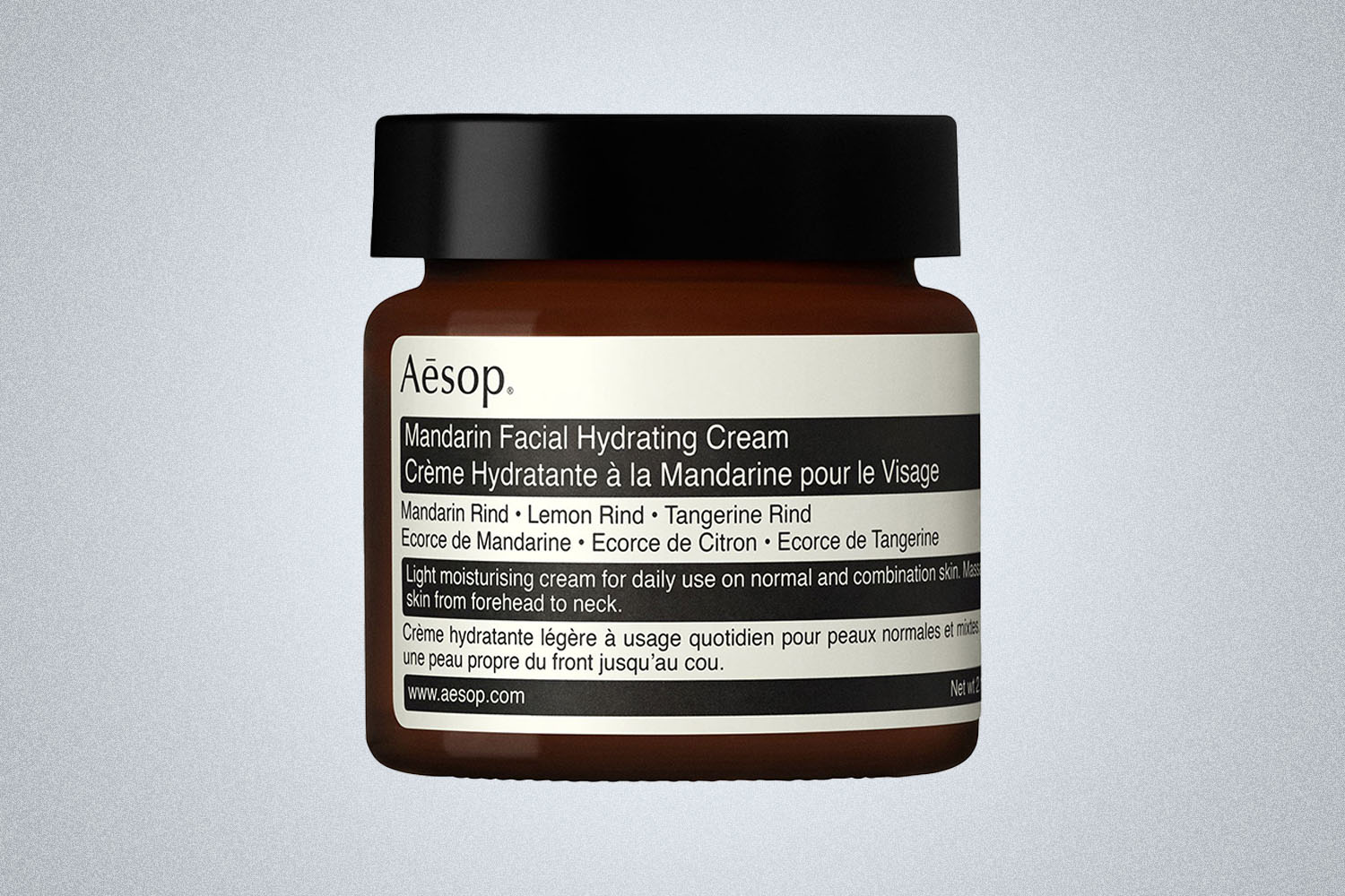 a Aesop skincare product on a grey background