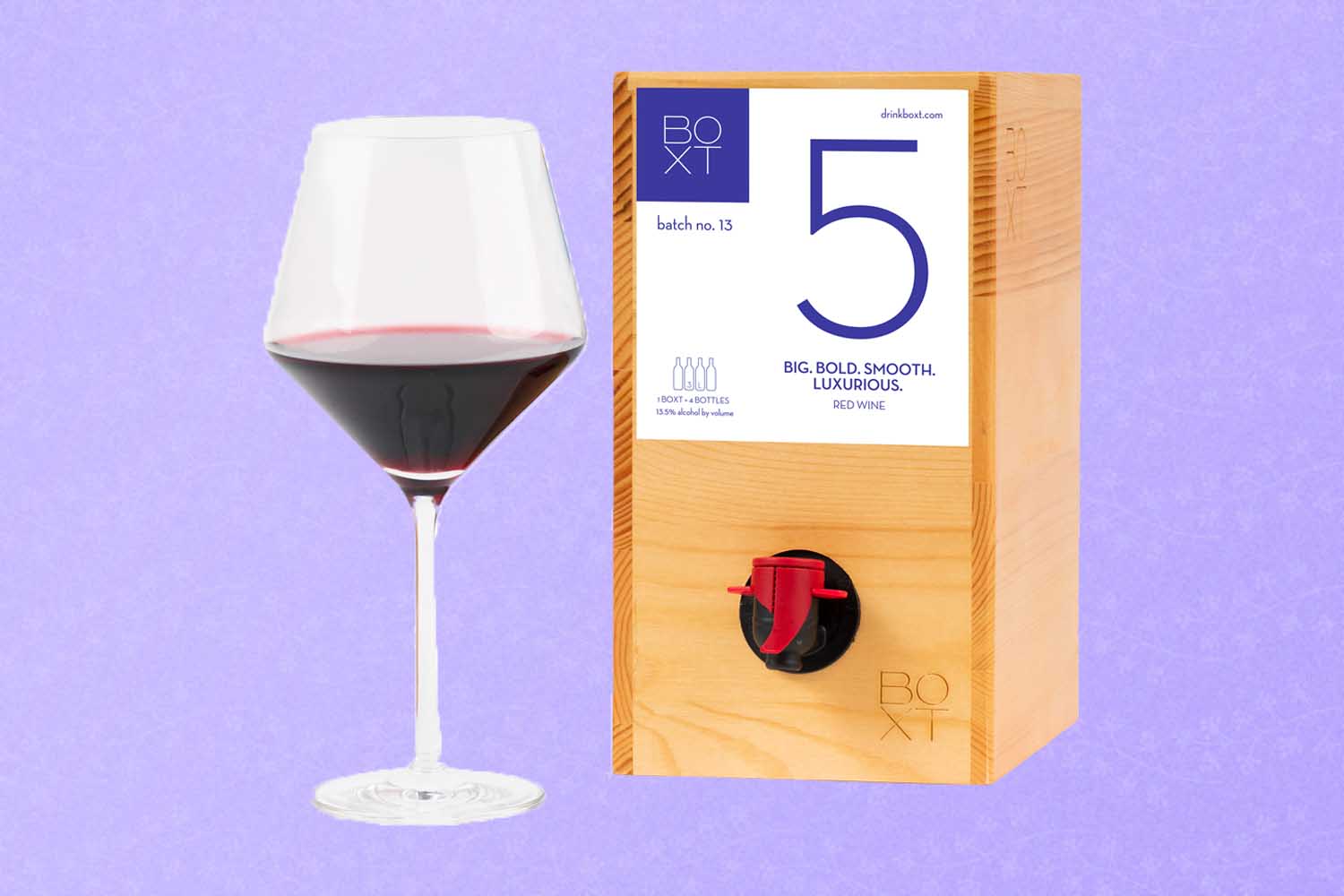 A wine glass and box of wine, a perfect Mother's Day gift for 2022, on a purple background.