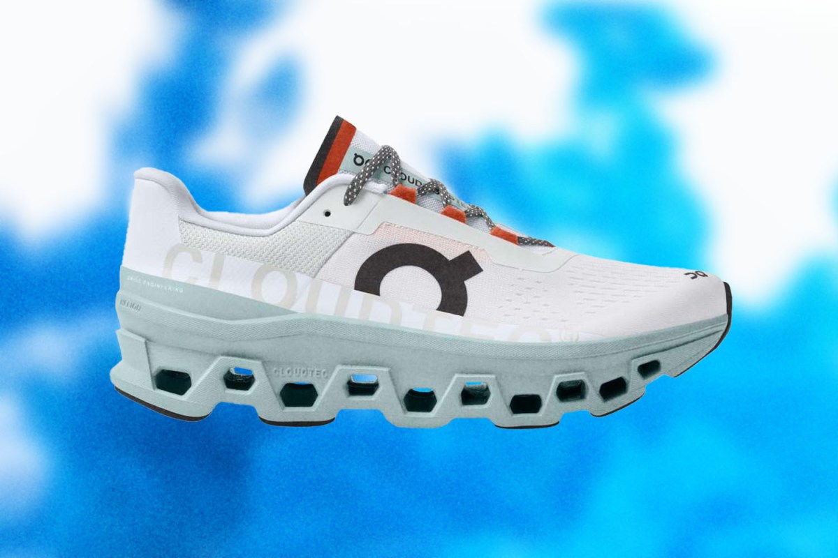 The new On Cloudmonster running shoe against a background of clouds.