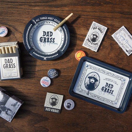 The Dad Grass and George Harrison "All Things Must Grass" collection, a lineup of CBD/CBG joints, rolling papers, ashtrays, rolling trays, pins, stickers and more