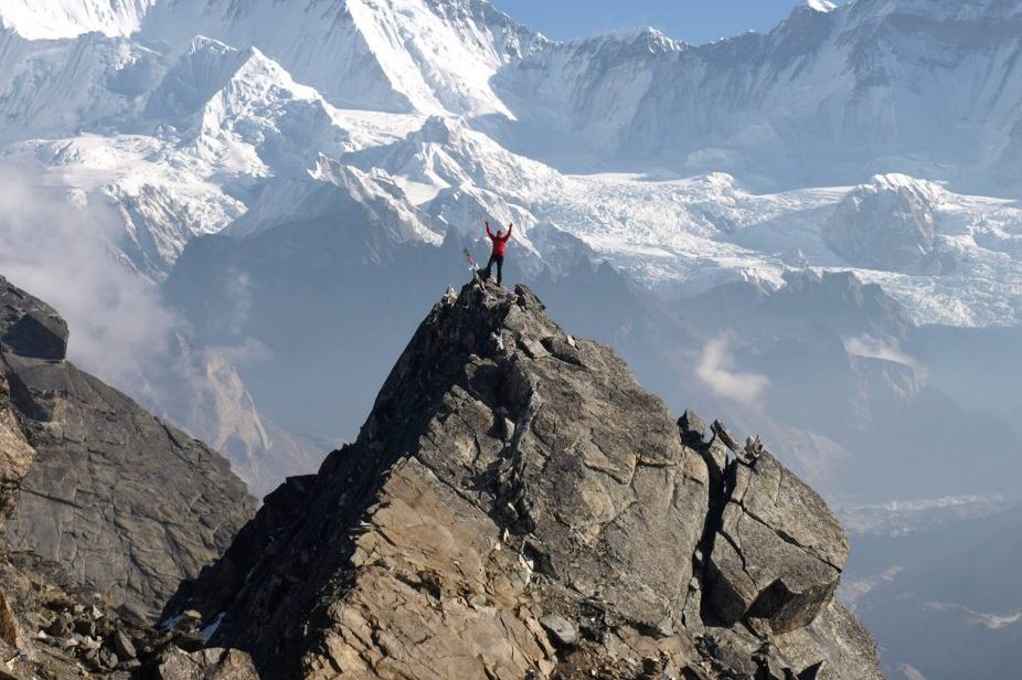 Karl Egloff looking victorious atop the Himalayas in 2013