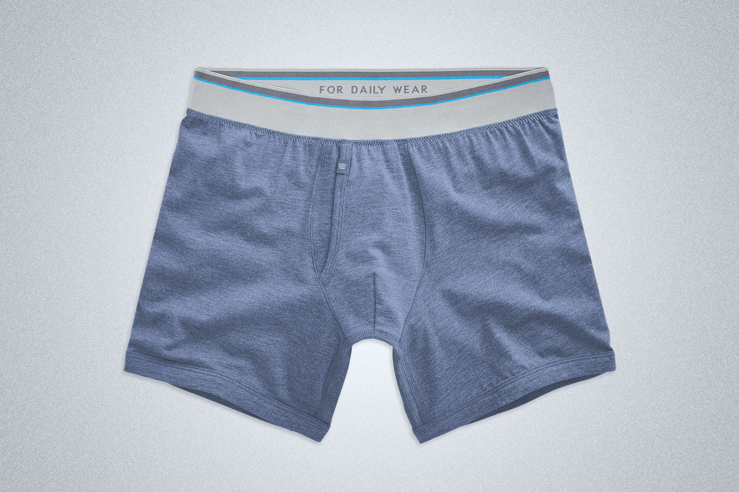 a pair of blue boxer briefs from Mack Weldon on a grey background