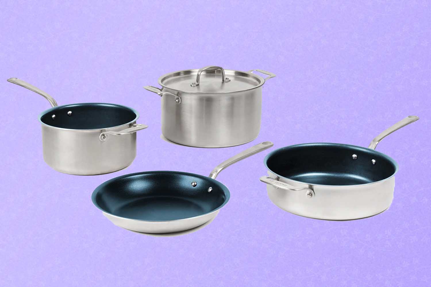 Four non-stick pieces of cookware, a perfect Mother's Day gift for 2022, on a purple background.
