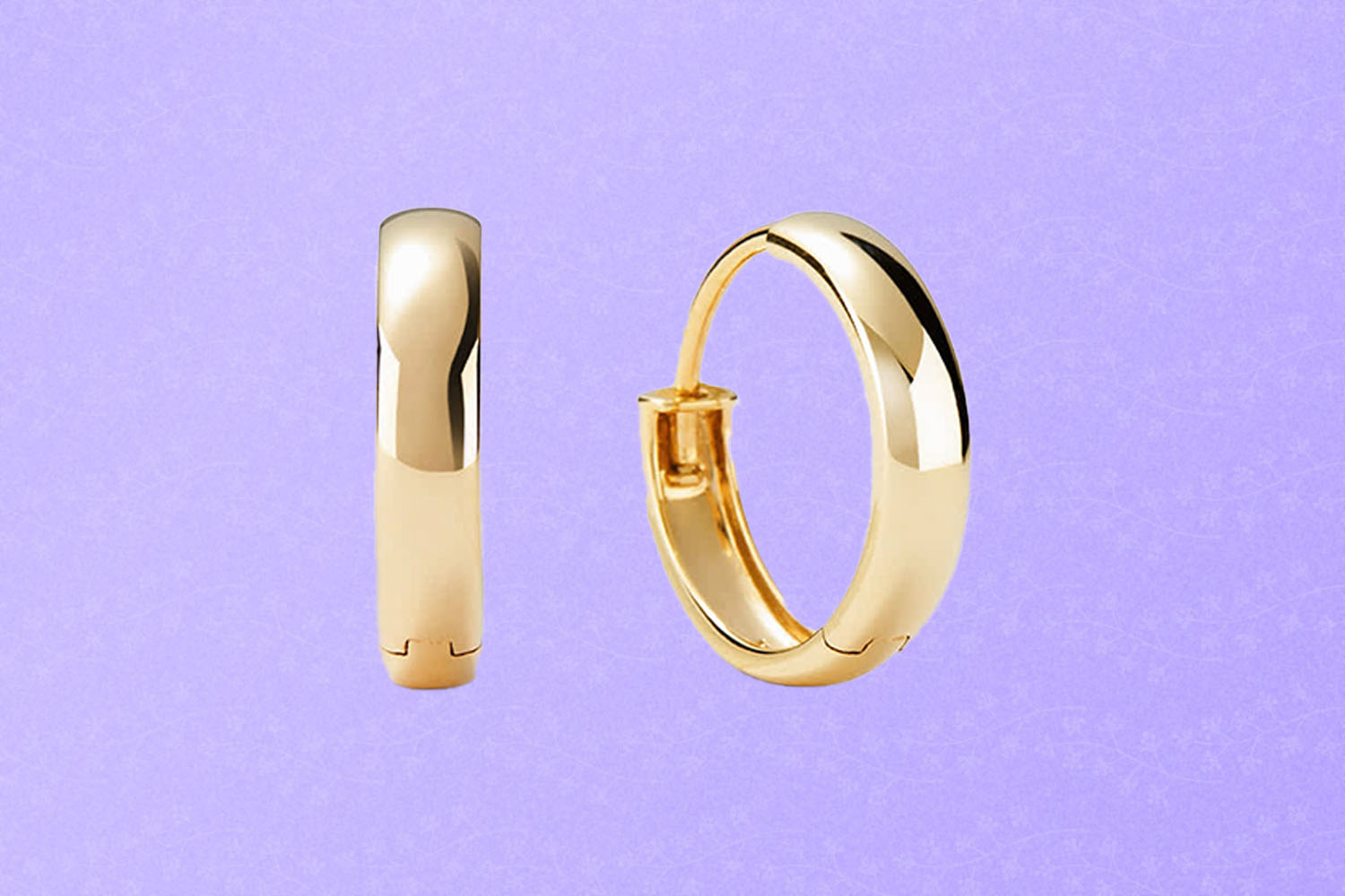 Small gold hoop earrings, a perfect Mother's Day gift for 2022, on a purple background.