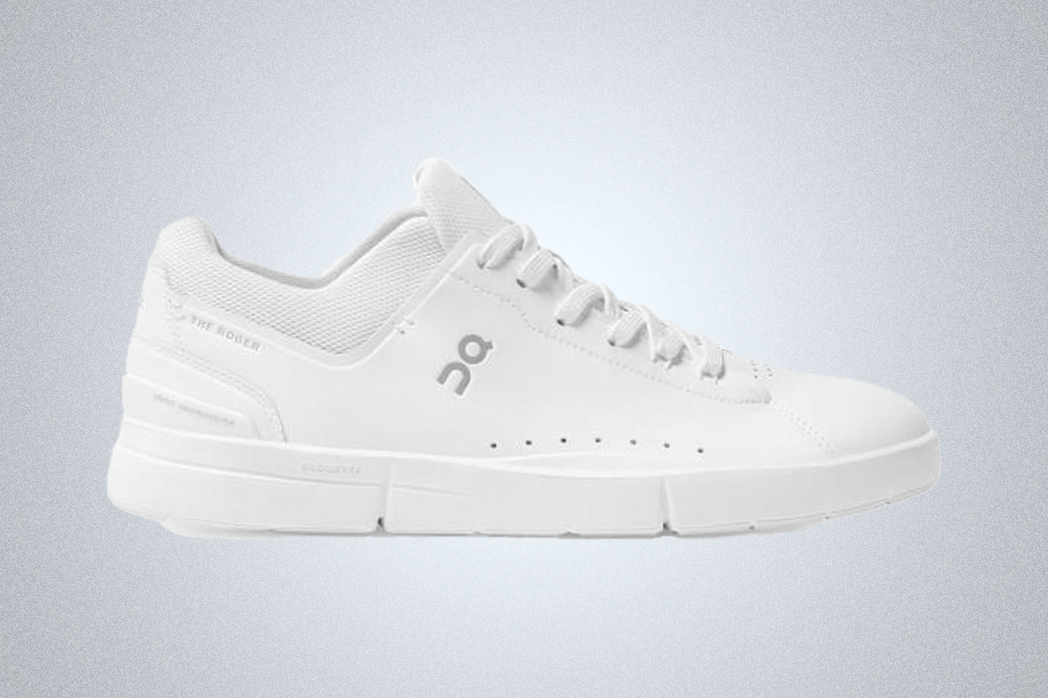 a white On tennis sneaker on a grey background