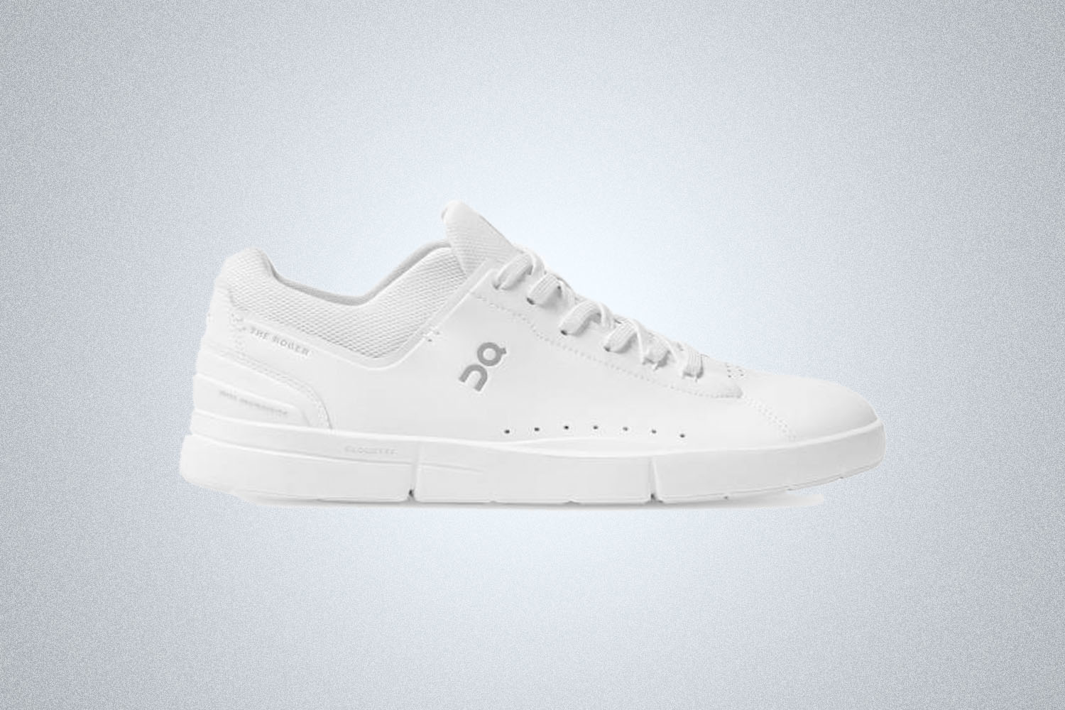 a pair of white On Roger Tennis Shoes on a grey background