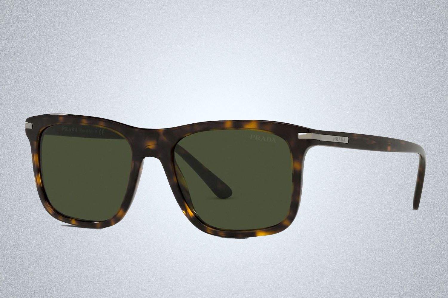 a pair of designer sunglasses from Prada on a grey background