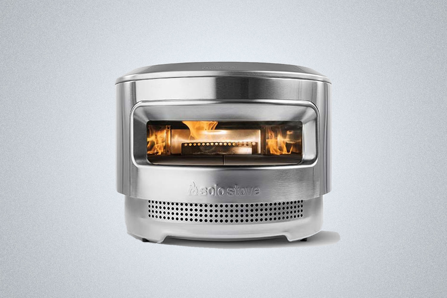 a pizza oven on a grey background