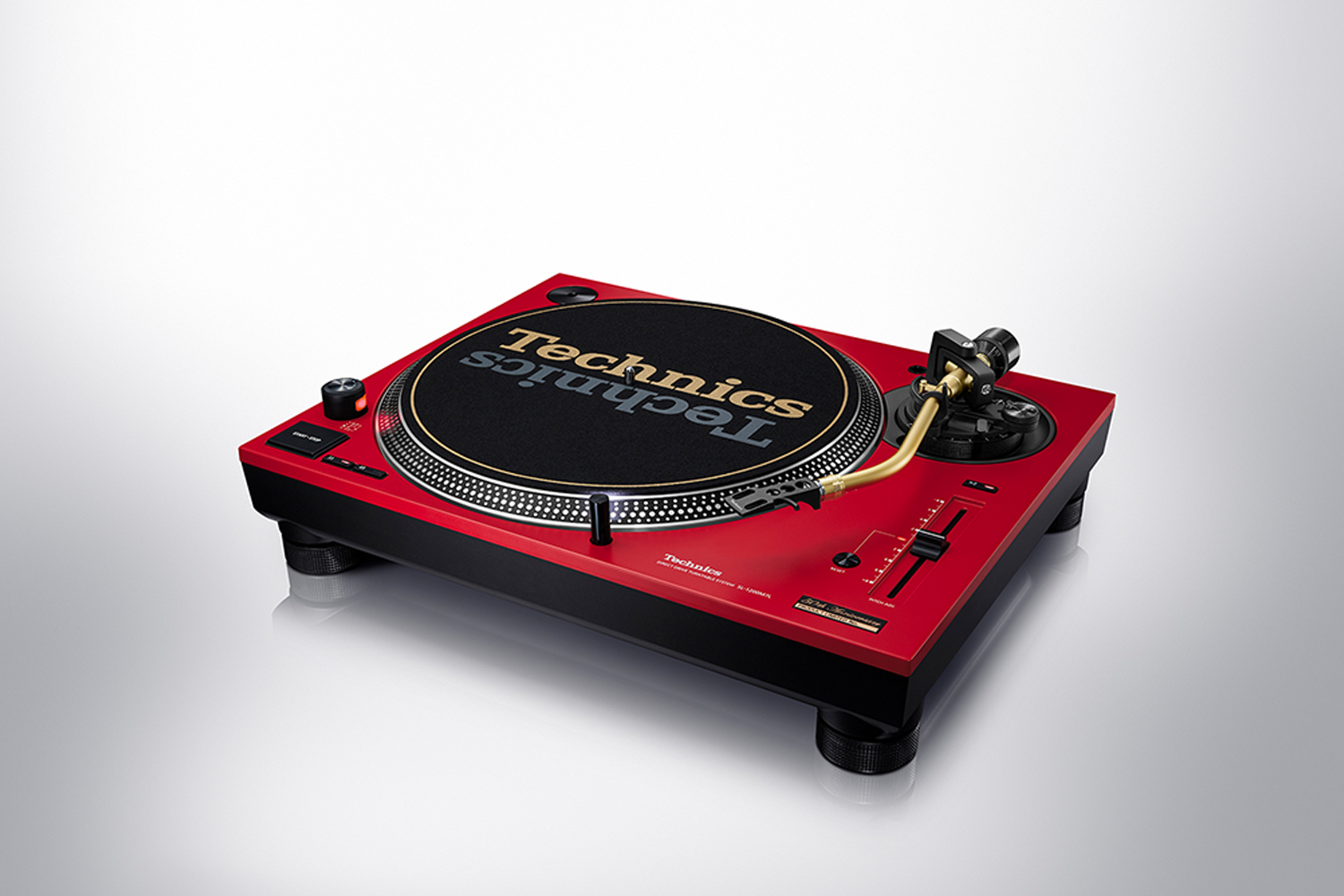 a red turntable on a grey background