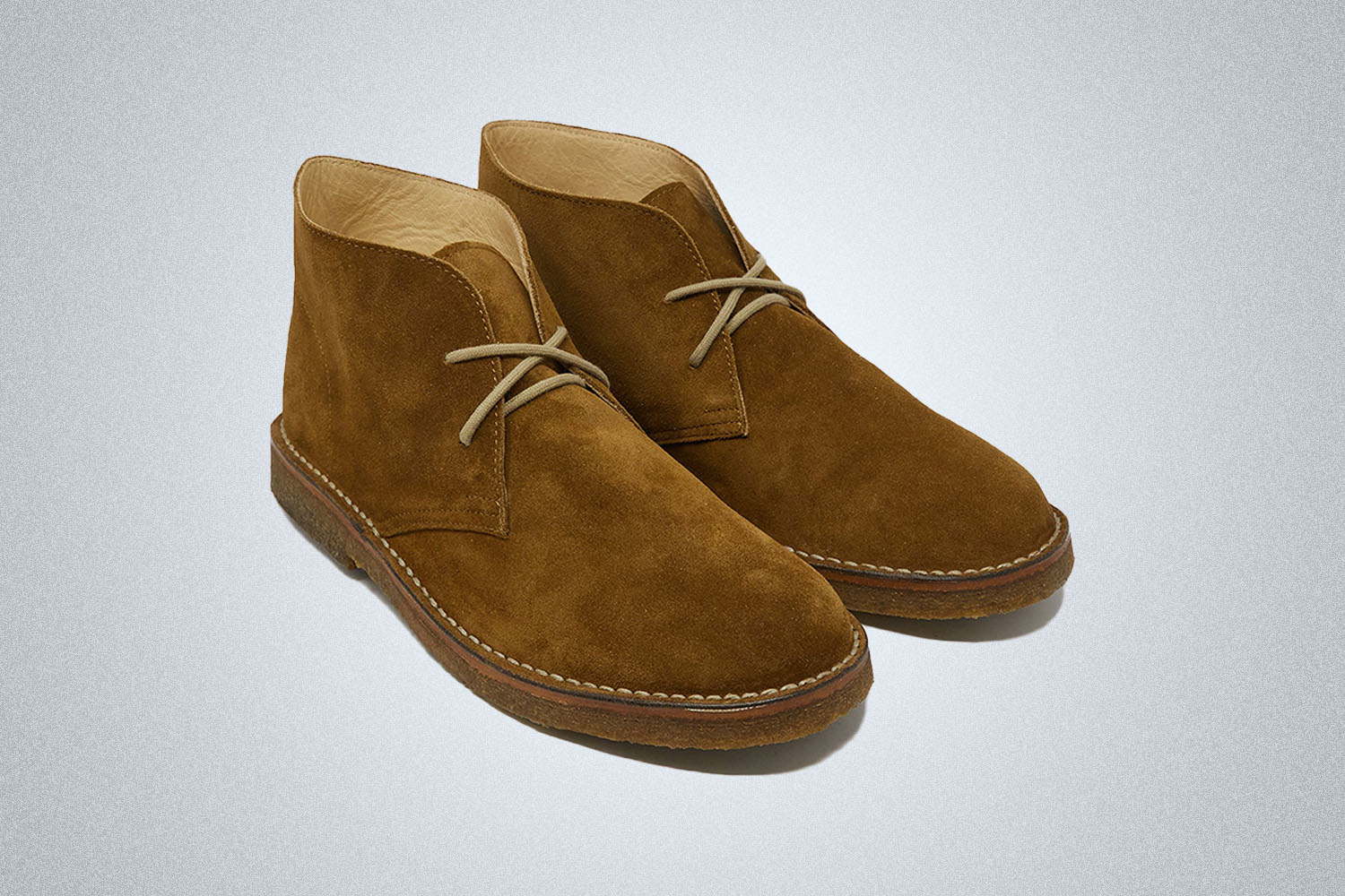 A pair of Chukka Boots from Todd Snyder on a grey background