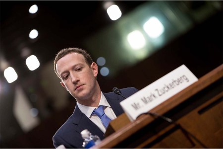 Facebook CEO Mark Zuckerberg listens during a joint hearing of the Senate Commerce, Science and Transportation Committee and Senate Judiciary Committee on Capitol Hill April 10, 2018