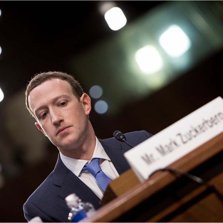 Facebook CEO Mark Zuckerberg listens during a joint hearing of the Senate Commerce, Science and Transportation Committee and Senate Judiciary Committee on Capitol Hill April 10, 2018