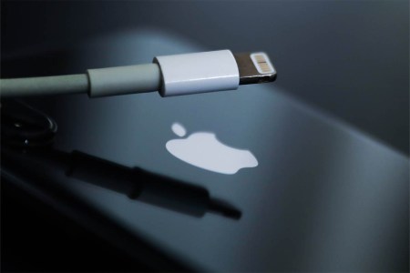 Lightning cable and Apple logo on iPhone are seen in this illustration photo taken in Krakow, Poland on September 25, 2021
