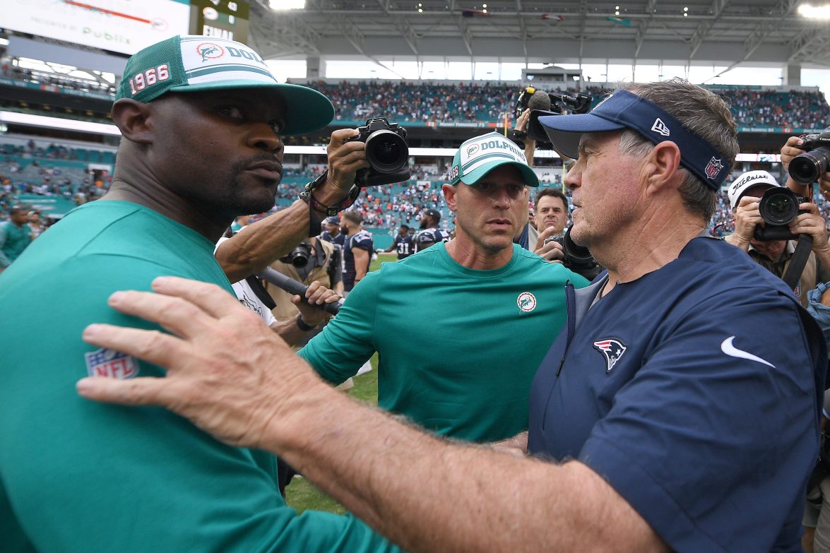 Ex-Miami coach Brian and Bill Belichick of the New England Patriots shake hands