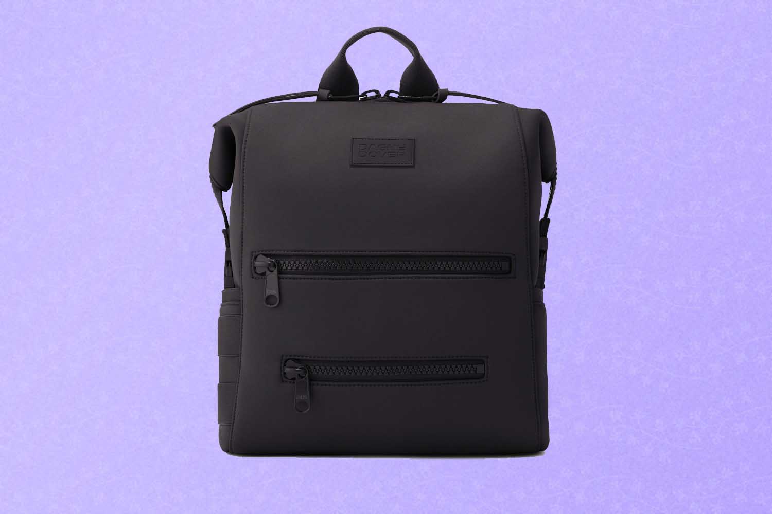 A black diaper bag, a perfect Mother's Day gift for 2022, on a purple background.