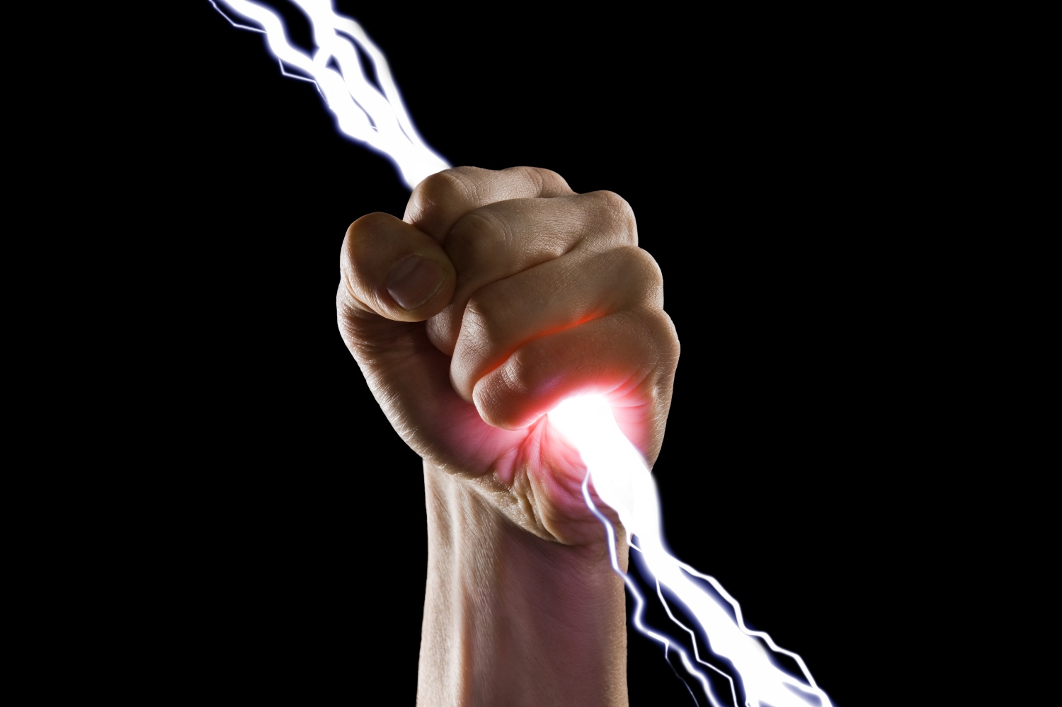 Close up image of man's fist holding a bolt of lightning