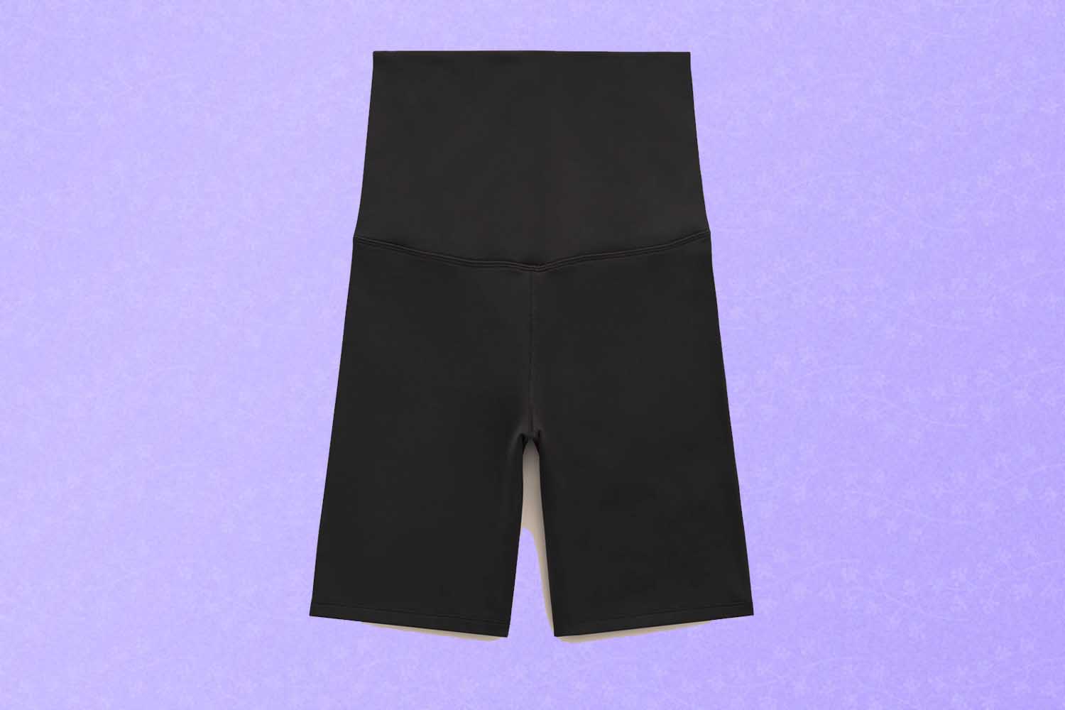 Black maternity biker shorts, a perfect Mother's Day gift for 2022, on a purple background.