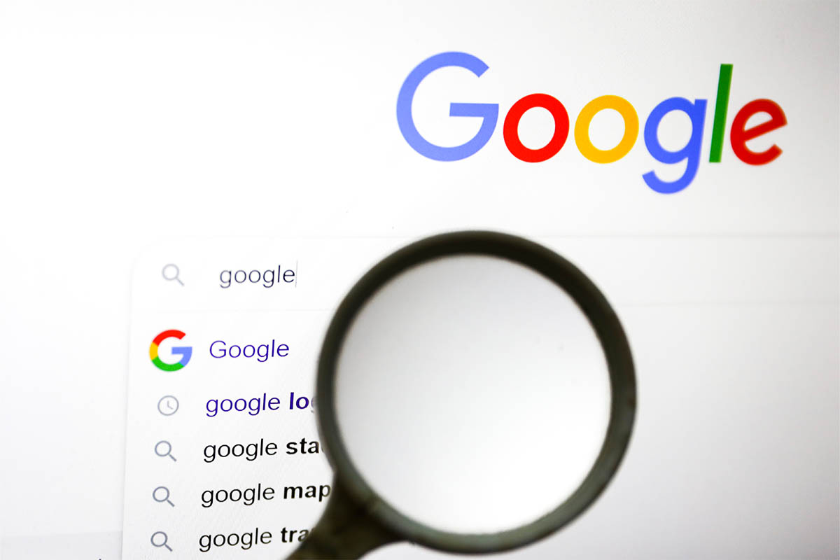 A magnifying glass is photographed with Google logo displayed on a laptop screen for illustration photo. Gliwice, Poland on January 23, 2022