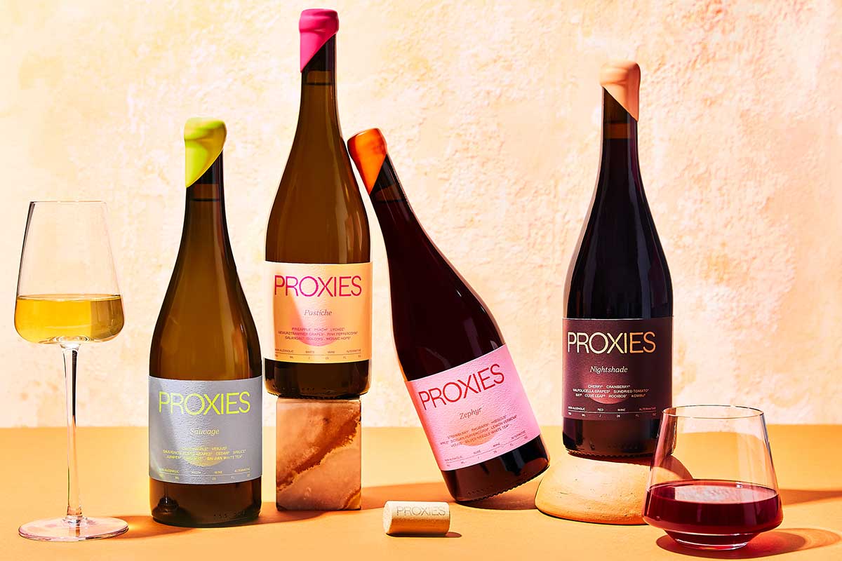 Four bottles of "Proxies" by Acid League, a non-alcoholic wine brand