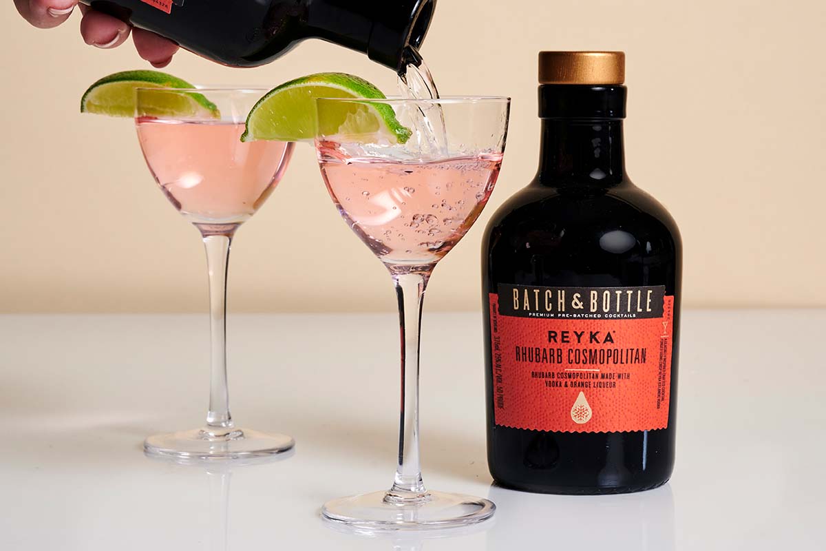 Two glasses and two bottles of the Reyka Rhubarb Cosmopolitan