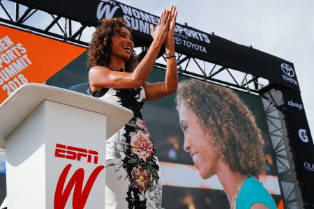 Sage Steele presents opening remarks at the espnW Summit in 2018. The ESPN anchor recently sued the Worldwide Leader for sidelining her after her own comments about Barack Obama's race and COVID-19 vaccine mandates.