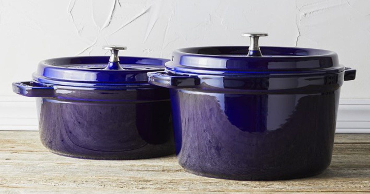 Two dark blue Dutch ovens from Staub on a countertop. Williams Sonoma is throwing a big Spring Cookware Event in April 2022 which sees discounts up to 60% off Staub and other top brands.
