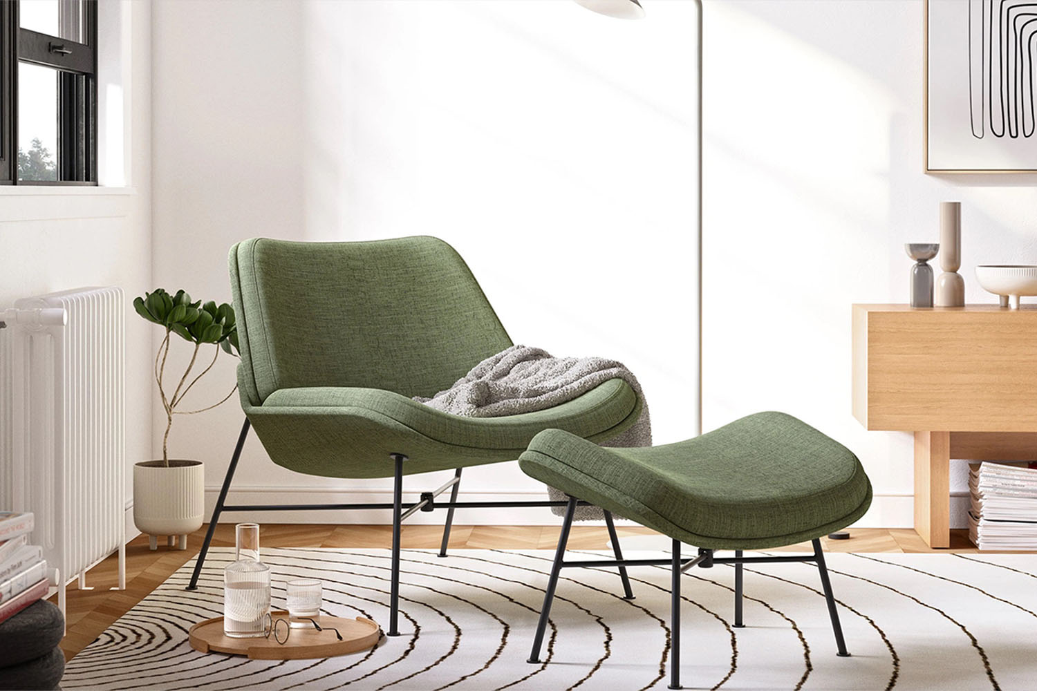 a photo of a green chair and footstool in a well furnished room.