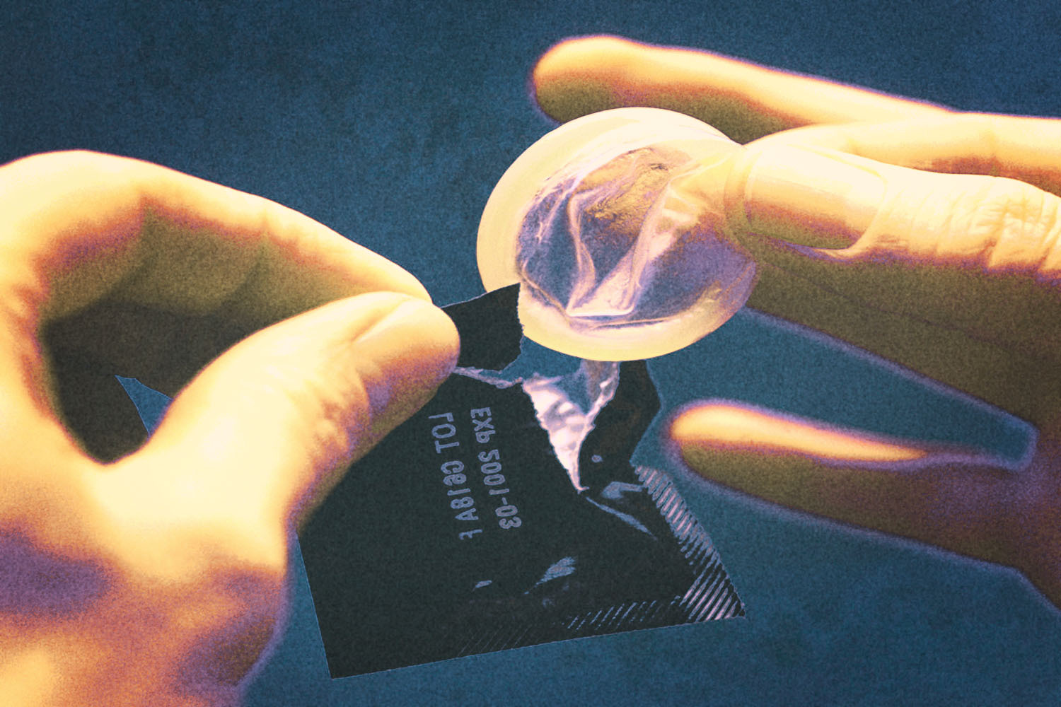 Close-up photo shows man taking condom out of wrapper