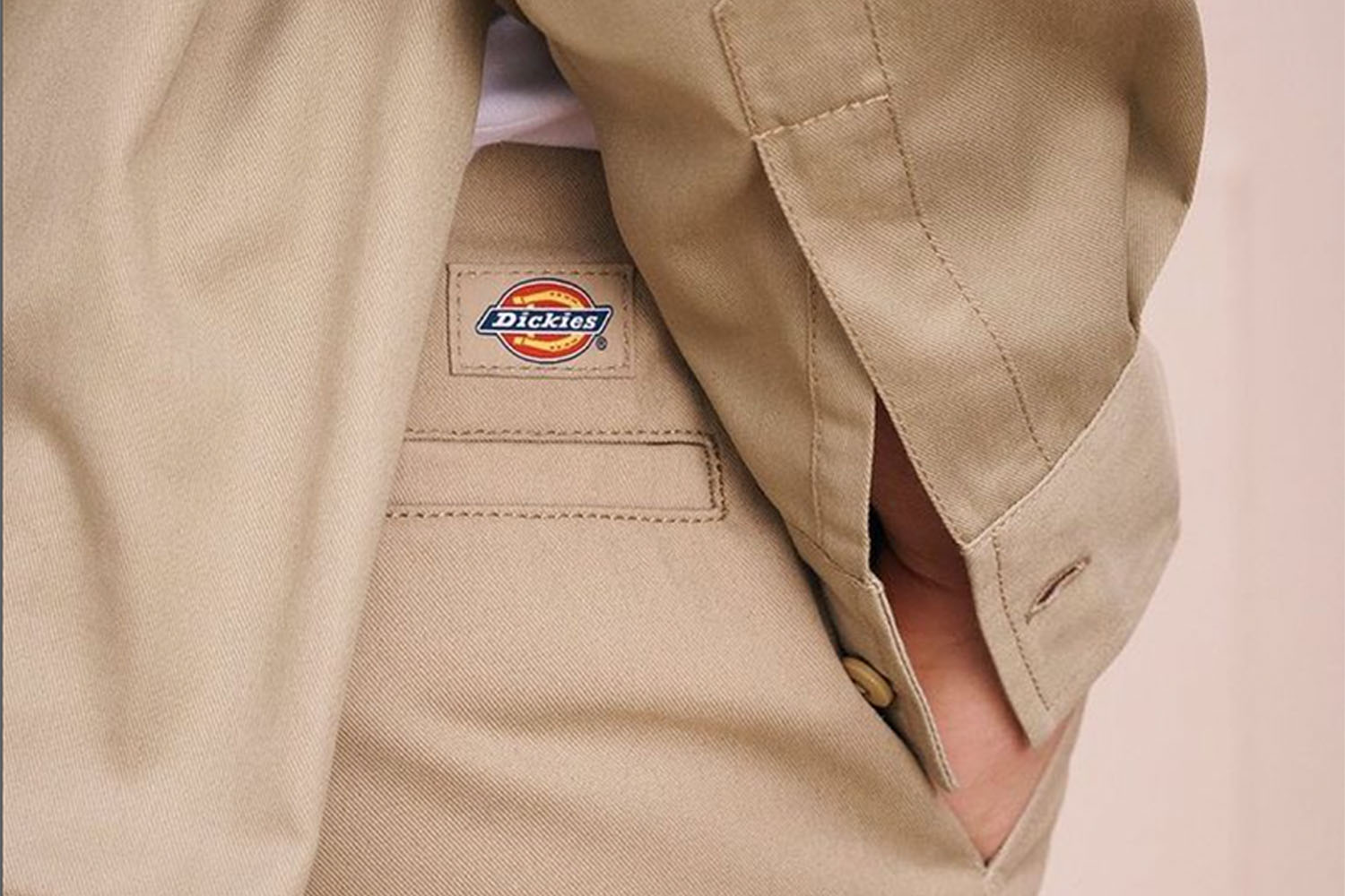 a close up shot of the Dickies logo on a pair of tan Dickies work pants