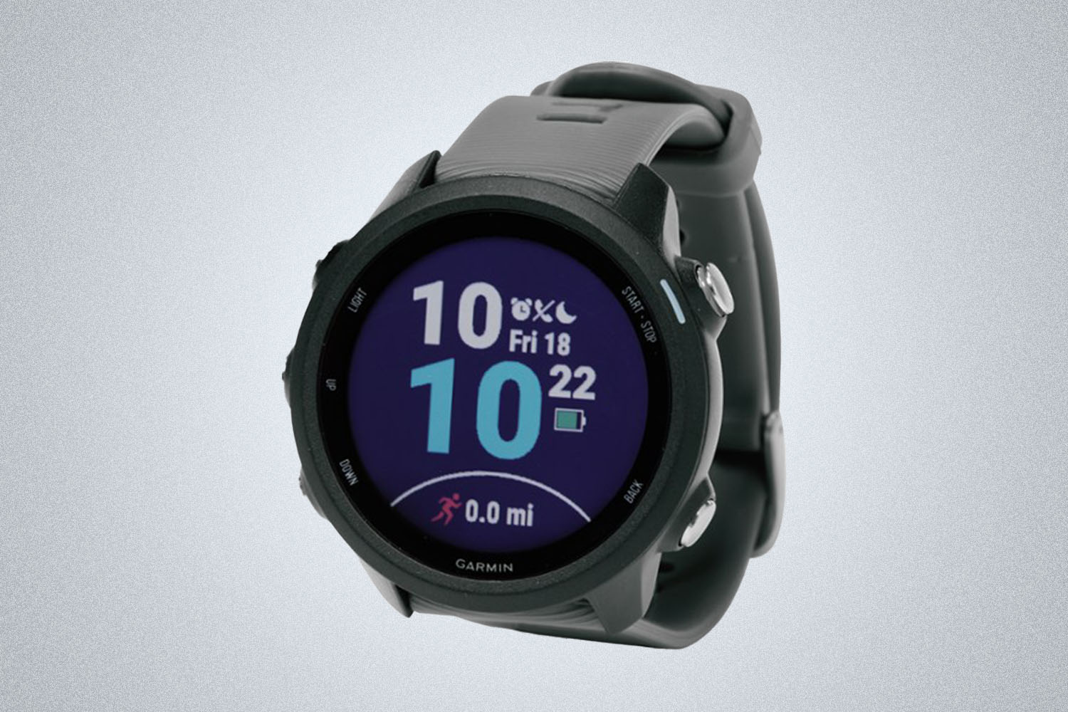 A Garmin GPS watch on a grey background