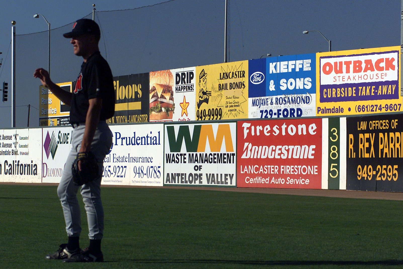 Advertisements cover the outfield walls of The Hangar, the Lancaster Jethawks baseball stadium.
