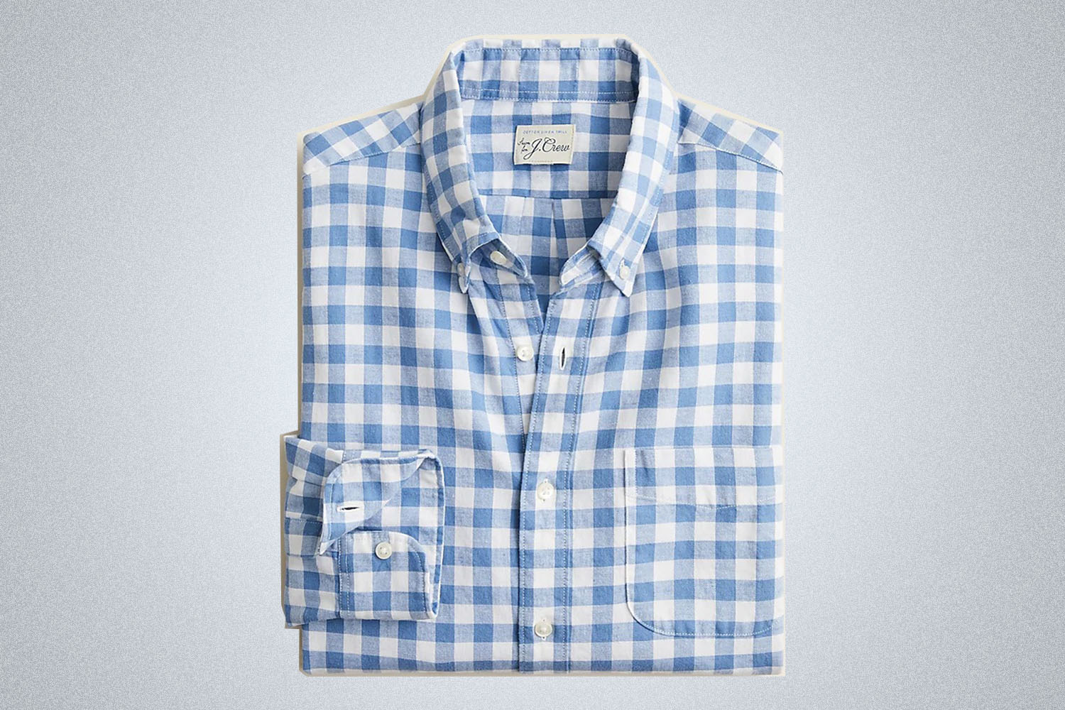 a checked blue and white shirt from J.Crew on a grey background