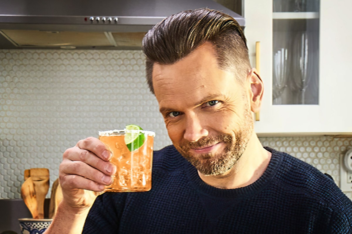 Joel McHale holding a margarita with mix from the brand he promotes, Q Mixers. His secret margarita hack? Barbecue sauce.